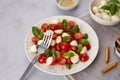 Caprese salad with cherry tomatoes , mozzarella cheese, basil Royalty Free Stock Photo