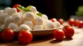 Caprese salad ingredients on a plate: mini mozzarella, ripe whole cherry tomatoes and fresh basil. Mozzarella Cheese, Cherry