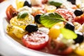 Caprese salad, mediterranean food, is served in white plate Royalty Free Stock Photo