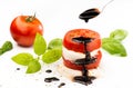 Caprese salad with mozzarella and tomato and balsamic glaze