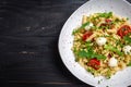 Caprese salad Pasta with tomato, mozzarella vegetable on a dark background, Restaurant menu, dieting, cookbook recipe top view Royalty Free Stock Photo