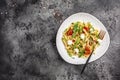 Caprese salad Pasta with tomato, mozzarella vegetable on a dark background, Restaurant menu, dieting, cookbook recipe top view Royalty Free Stock Photo