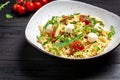 Caprese salad Pasta with tomato, mozzarella vegetable on a dark background, Restaurant menu, dieting, cookbook recipe top view Royalty Free Stock Photo