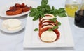 Caprese salad with roasted tomatoes, mozzarella and basil