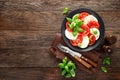 Caprese salad. Salad with mozzarella cheese, fresh tomatoes, basil leaves and olive oil. Italian cuisine Royalty Free Stock Photo