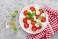 Caprese salad. Salad with mozzarella cheese fresh tomatoes, basil leaves and olive oil. Italian food Royalty Free Stock Photo