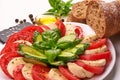 Caprese Salad. Tomato and Mozzarella slices with basil leaves with ciabatta bread. Isolated on white background Royalty Free Stock Photo