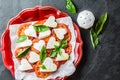 Caprese salad with tomatoes, cheese hearts, basil. Valentine day menu