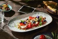 Caprese salad with tomatoes, mozzarella, and berries, rustic bright lighting, Royalty Free Stock Photo