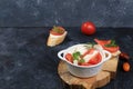 Caprese and Toast bruschetta with mozzarella cheese, cherry tomatoes and fresh garden basil. Traditional Italian food, healthy Royalty Free Stock Photo