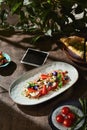 Caprese with tomatoes, mozzarella and berries, bright natural light, overhead Royalty Free Stock Photo