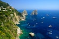 Capri coast view with Faraglioni rocks and boats, Italy