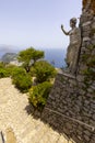 Statue of Emperor Augustus on Monte Solaro and view of rocks Faraglioni, Capri Island, Italy Royalty Free Stock Photo