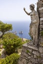 Statue of Emperor Augustus on Monte Solaro and view of rocks Faraglioni, Capri Island, Italy Royalty Free Stock Photo