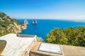 Sundial in Gardens of Augustus, famous Faraglioni rocks near Capri island, Italy