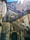 Narrow concrete upside stairs next to narrow street