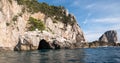 Caves in the cliffs on the island of Capri in the Bay of Naples, Italy. Photographed whilst on a boat trip around the island. Royalty Free Stock Photo