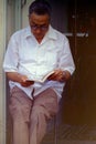 CAPRI, ITALY, 1970 - A man reads his book absorbed