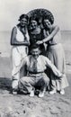 Capri, Italy, 1933 - Three tanned girls and their frind joke on the beach