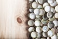 Caps of beer on a wooden board, top view Royalty Free Stock Photo