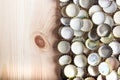 Caps of beer on a wooden board, top view Royalty Free Stock Photo