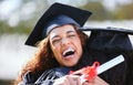 Caps off to us for making it here together. a young woman hugging her friend on graduation day. Royalty Free Stock Photo