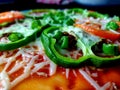 Capsicum cheese and red tomato sauce on a pizza Royalty Free Stock Photo