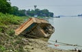 Capsized boat on a river bank Royalty Free Stock Photo