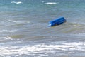Capsized inflatable boat in the sea Royalty Free Stock Photo