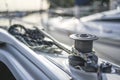 Capstan with line on a sailboat with white background.