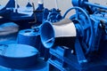 Capstan and other mechanisms, painted blue, on the foredeck of the ship, close-up