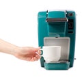 Capsular electric coffee machine cup in hand Royalty Free Stock Photo