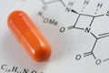A capsule and chemical formula Royalty Free Stock Photo