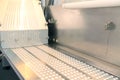 Capsule medicine pill production line, Industrial pharmaceutical concept. Tablets coming out of the machine. Pharmacy Royalty Free Stock Photo