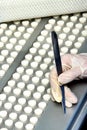 Capsule medicine pill production line, Industrial pharmaceutical concept. Tablets coming out of the machine. Pharmacy Royalty Free Stock Photo