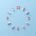 Capsule pill forms a clock face. top or front view light blue background. Health care remind to take your medicine on time.