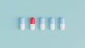 Capsule pills in row on blue background, healthcare medical concept, antibiotics and cure, 3d render Royalty Free Stock Photo