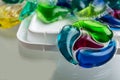Capsules with laundry gel and blurred background close up Royalty Free Stock Photo