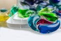 Capsules with laundry gel and blurred background close up Royalty Free Stock Photo