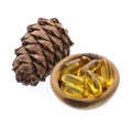 Capsules of oil turpentine with cedar cone Royalty Free Stock Photo