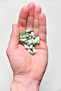 Capsules, tablets in hand. Lots of medicines. Capsule vitamins