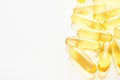 Capsules. Yellow pills isolated on white. Close up capsules with Vitamin D, E or Omega 3,6,9 fatty acids. Food supplement oil
