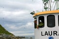 Captain of ship at Puffin Island in Norway