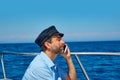 Captain cap sailor man talking mobile phone boat Royalty Free Stock Photo