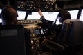 Captain and copilot switching power engine buttons on dashboard