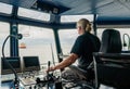 Captain of deck Officer on bridge of vessel or ship during navigaton watch at sea