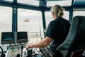 Captain of deck Officer on bridge of vessel or ship during navigaton watch at sea