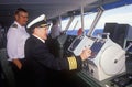 The captain of the ferry Bluenose piloting his boat as a navigator stands by, Yarmouth, Nova Scotia