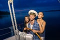 Captain with girls on the yacht. Royalty Free Stock Photo