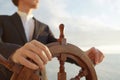 Captain. Hands on ship rudder. Royalty Free Stock Photo
